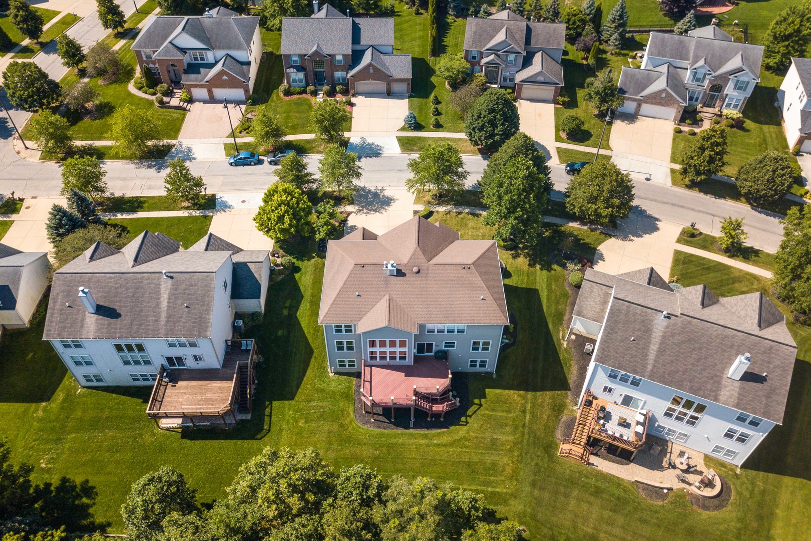 409 Wildflower Way Streamwood, IL 60107 - Photo 42 of 53 an aerial view of a house with a swimming pool outdoor seating and yard