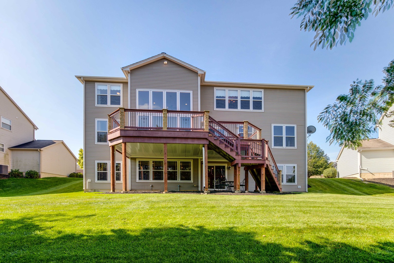 409 Wildflower Way Streamwood, IL 60107 - Photo 44 of 53 a view of a house with a yard and sitting area