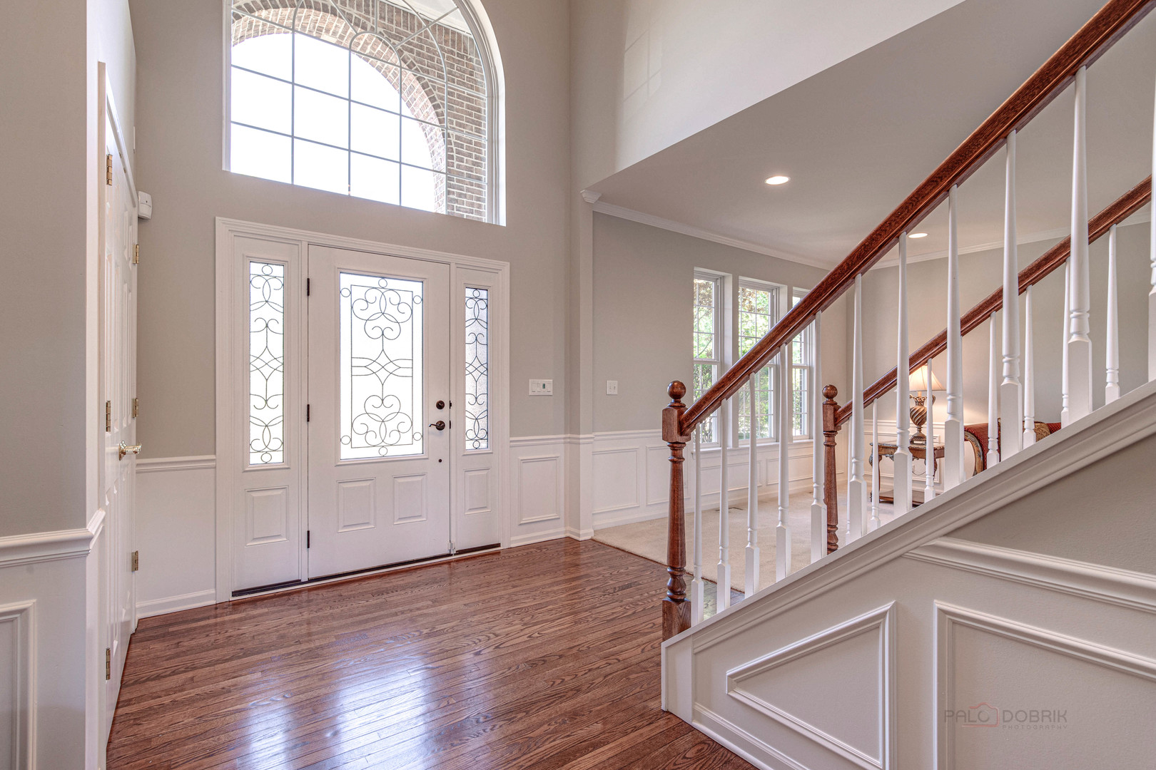 409 Wildflower Way Streamwood, IL 60107 - Photo 5 of 53 a view of an entryway with wooden floor and windows