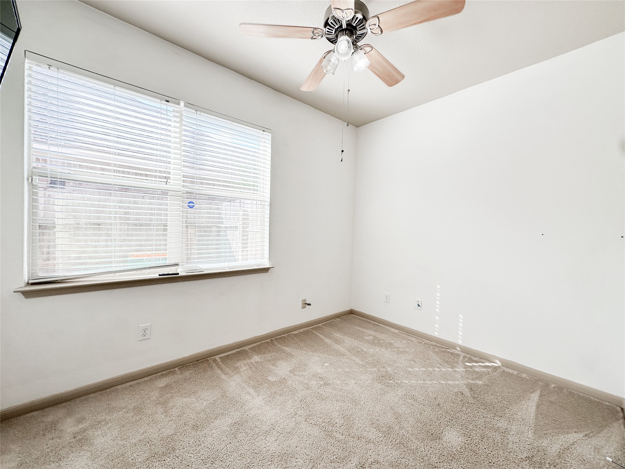 20319 Little Wing Drive Spring, TX 77388 - Photo 15 of 49 a view of an empty room with a window
