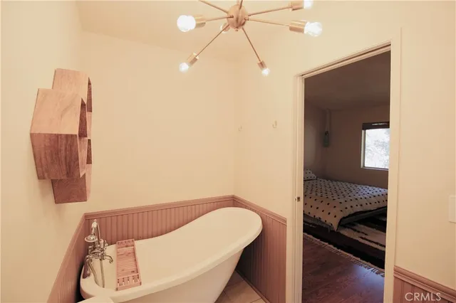 a bedroom with a bed and a walk in closet