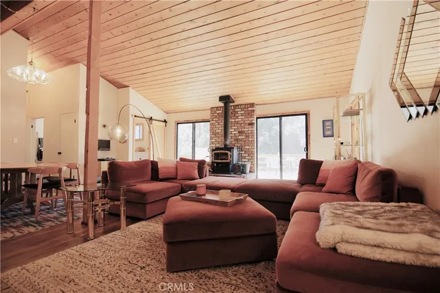 a living room with furniture ceiling fan and a rug