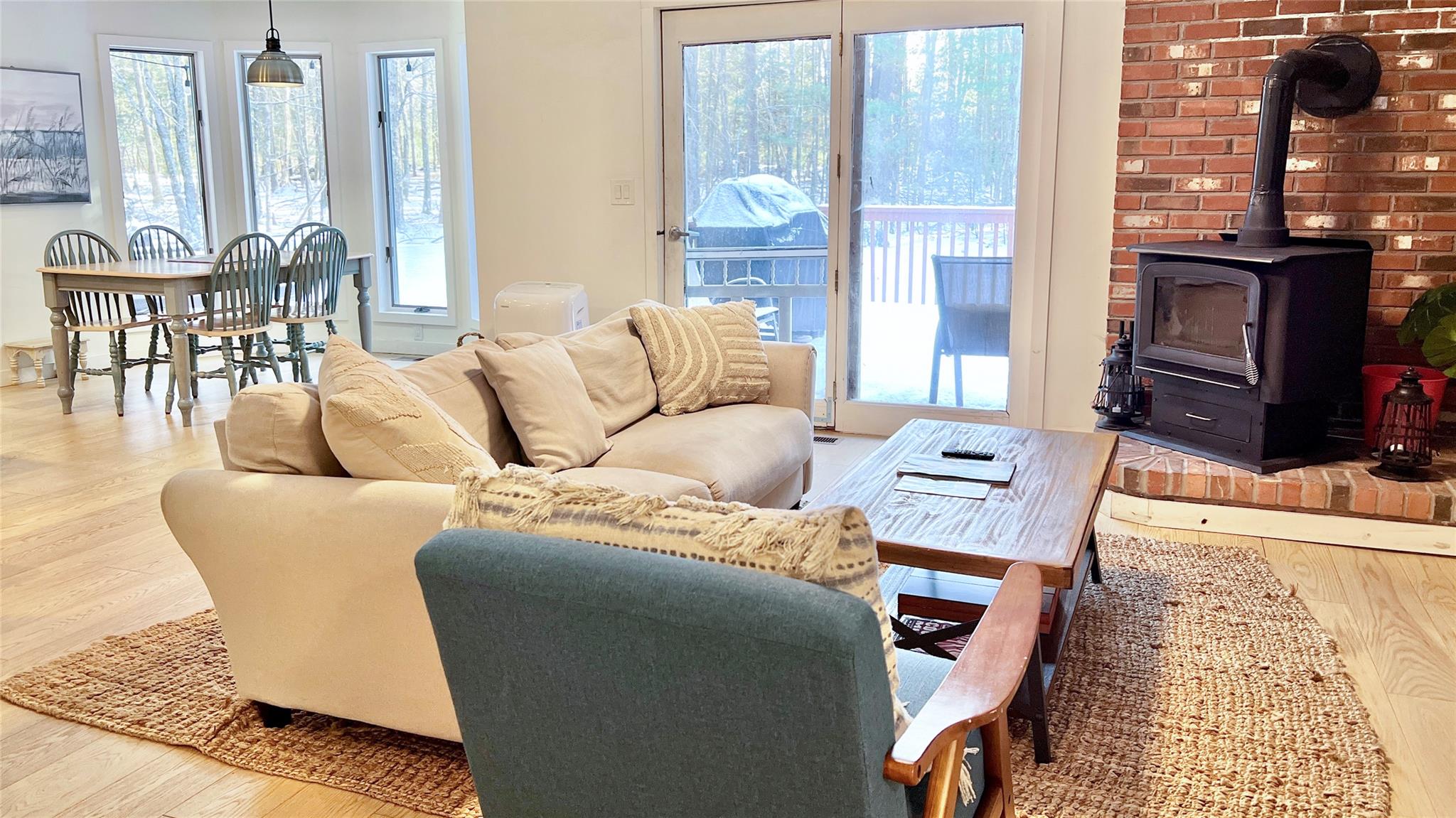 471 Horseshoe Lake Road Swan Lake, NY 12783 - Photo 19 of 39 a living room with furniture a large window and a dining table