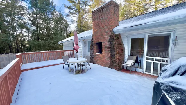 a view of a patio with a table and chairs