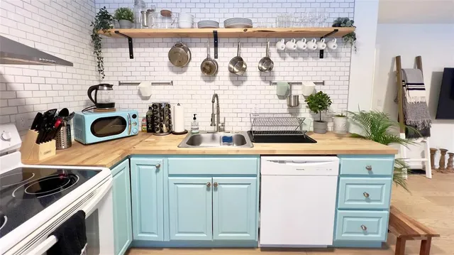 a kitchen with a stove and cabinets
