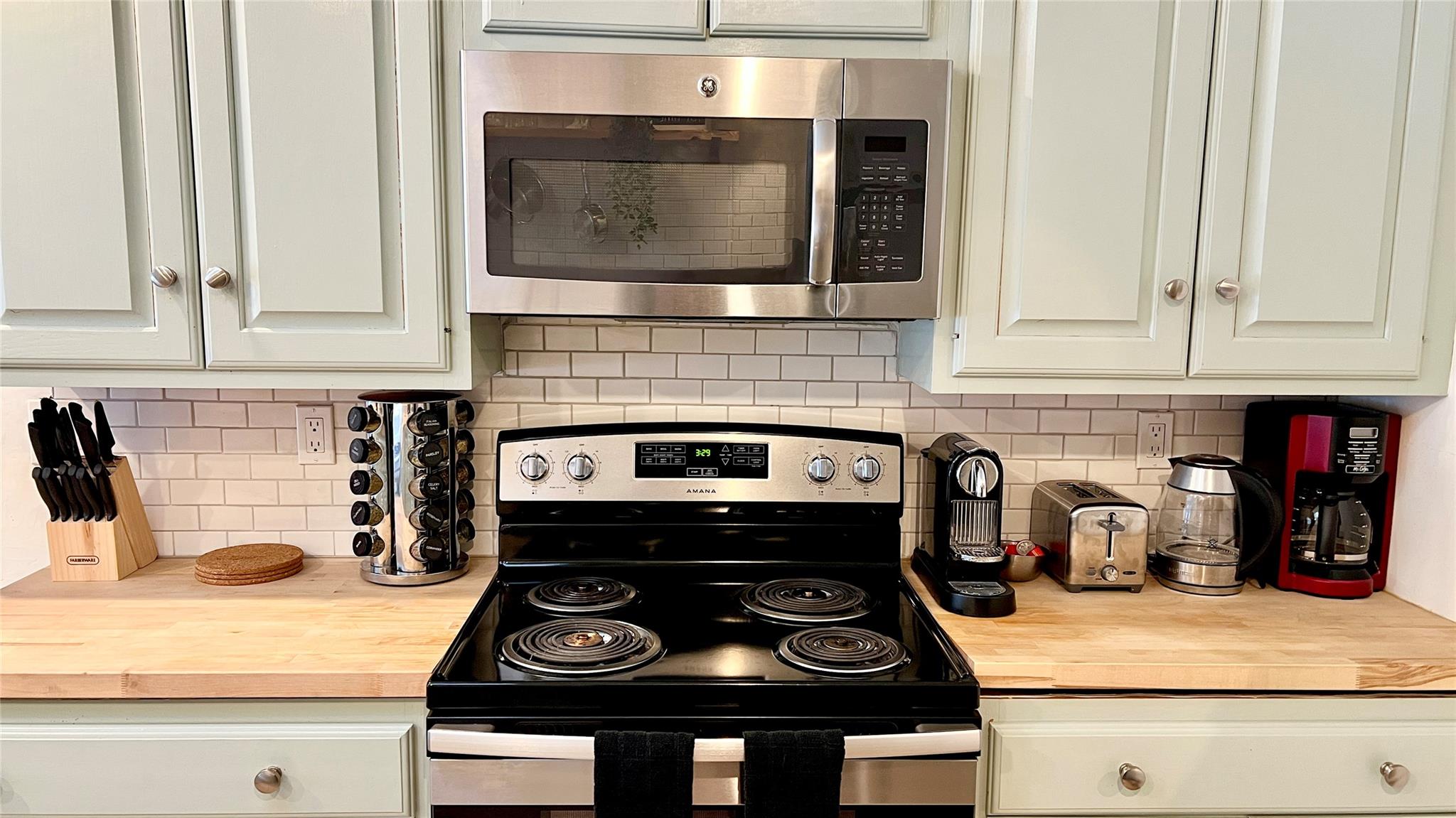 471 Horseshoe Lake Road Swan Lake, NY 12783 - Photo 4 of 39 a stove top oven sitting inside of a kitchen
