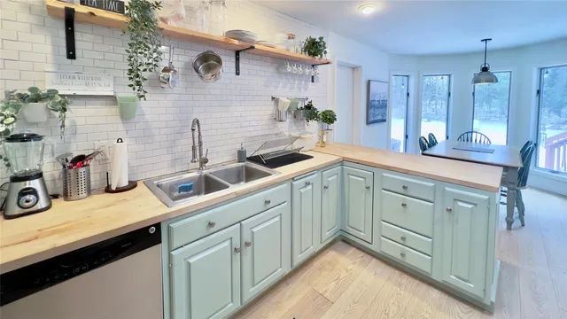 a kitchen with a sink and cabinets