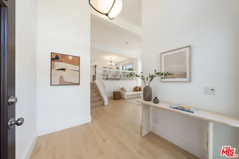 a view of a living room and workspace