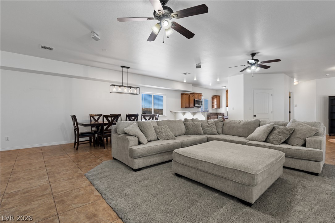 575 Gann Avenue Logandale, NV 89021 - Photo 13 of 75 An inviting gathering space where modern living meets casual comfort, perfect for daily routines.