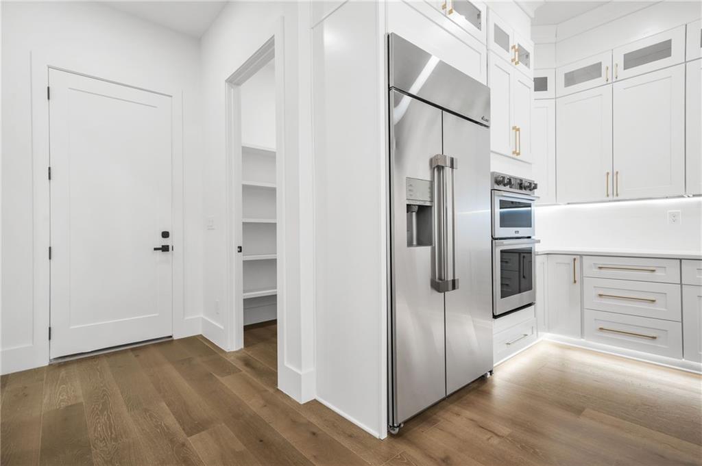 5175 Cascade Road Atlanta, GA 30331 - Photo 13 of 62 a kitchen with stainless steel appliances a refrigerator and cabinets
