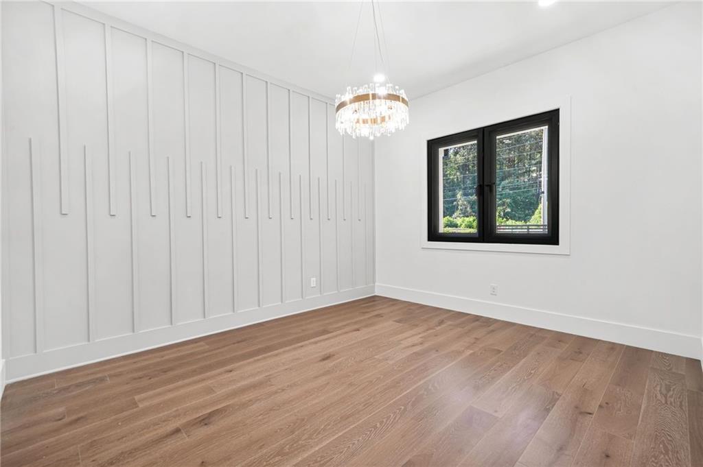 5175 Cascade Road Atlanta, GA 30331 - Photo 16 of 62 a view of an empty room with wooden floor and a window