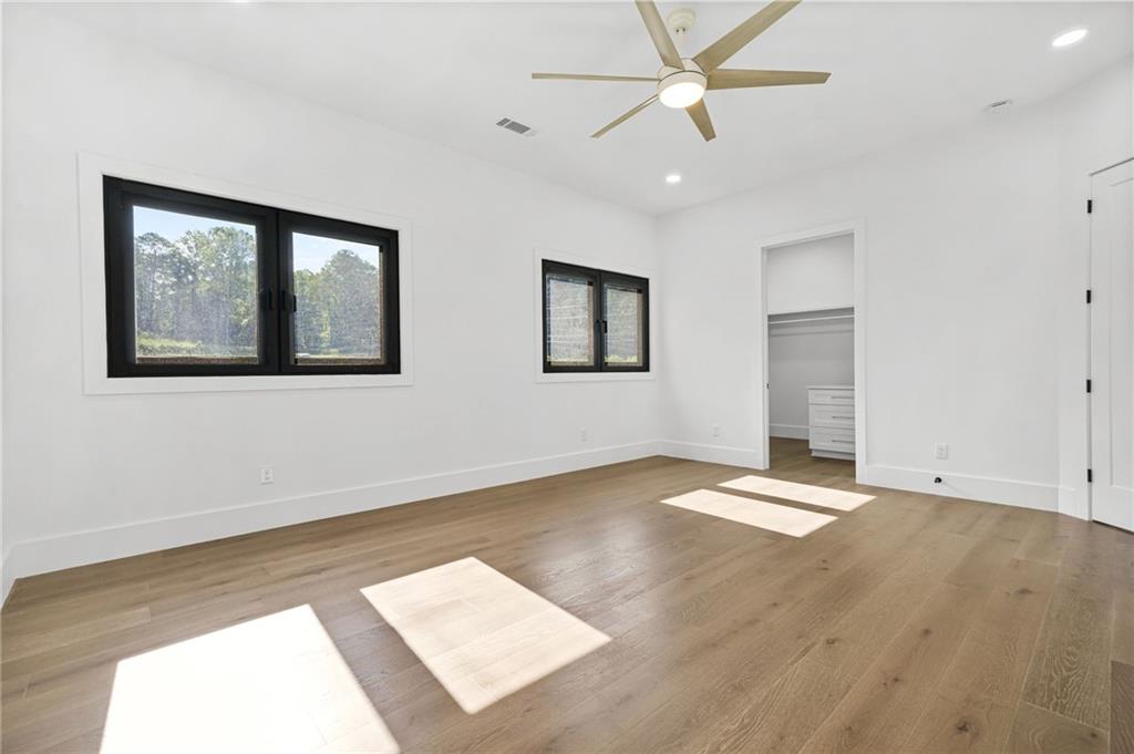 5175 Cascade Road Atlanta, GA 30331 - Photo 20 of 62 a view of an empty room with window and wooden floor