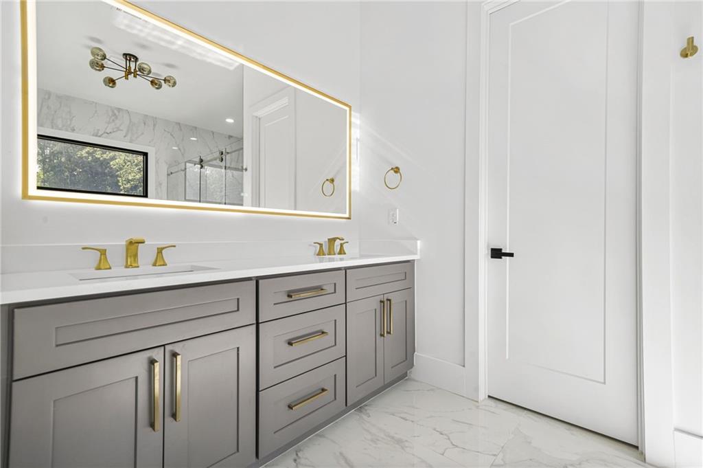 5175 Cascade Road Atlanta, GA 30331 - Photo 22 of 62 a bathroom with a granite countertop sink mirror and