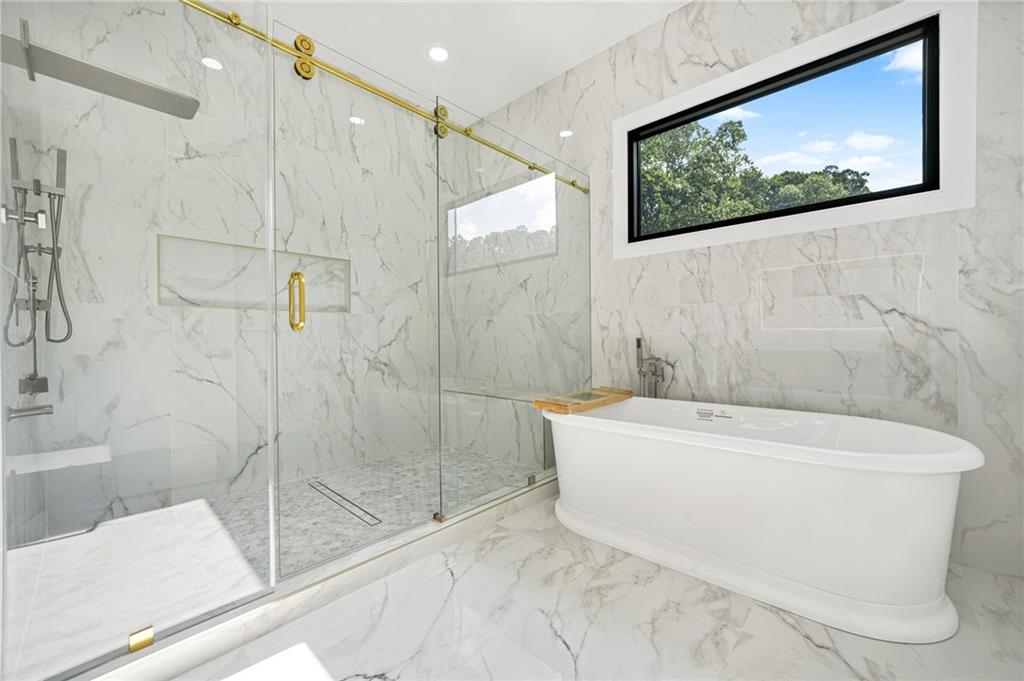 5175 Cascade Road Atlanta, GA 30331 - Photo 23 of 62 a bathroom with a bathtub and shower