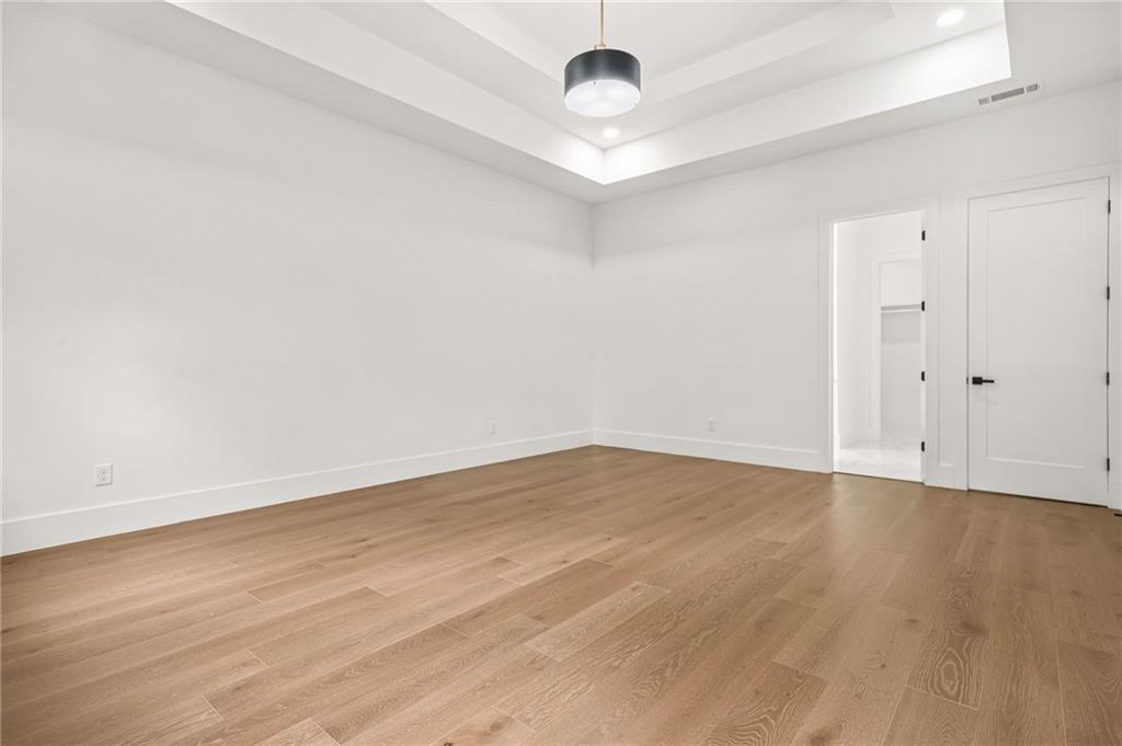 5175 Cascade Road Atlanta, GA 30331 - Photo 51 of 62 an empty room with wooden floor and ceiling fan