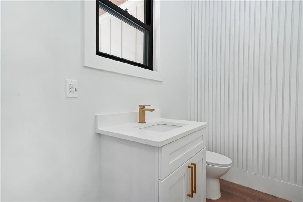 5175 Cascade Road Atlanta, GA 30331 - Photo 58 of 62 a bathroom with a toilet a sink and mirror