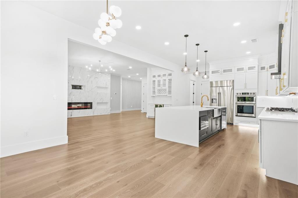 5175 Cascade Road Atlanta, GA 30331 - Photo 10 of 62 a large white kitchen with a large counter top appliances and cabinets