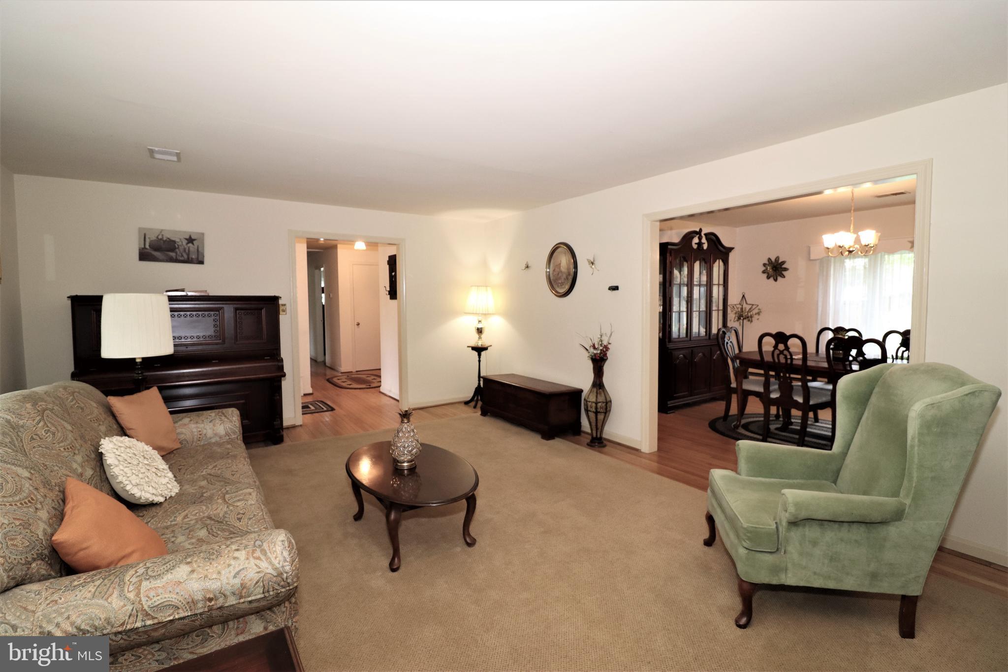 22 Blue Ridge Street Warrenton, VA 20186 - Photo 8 of 28 Living room opens to dining room
