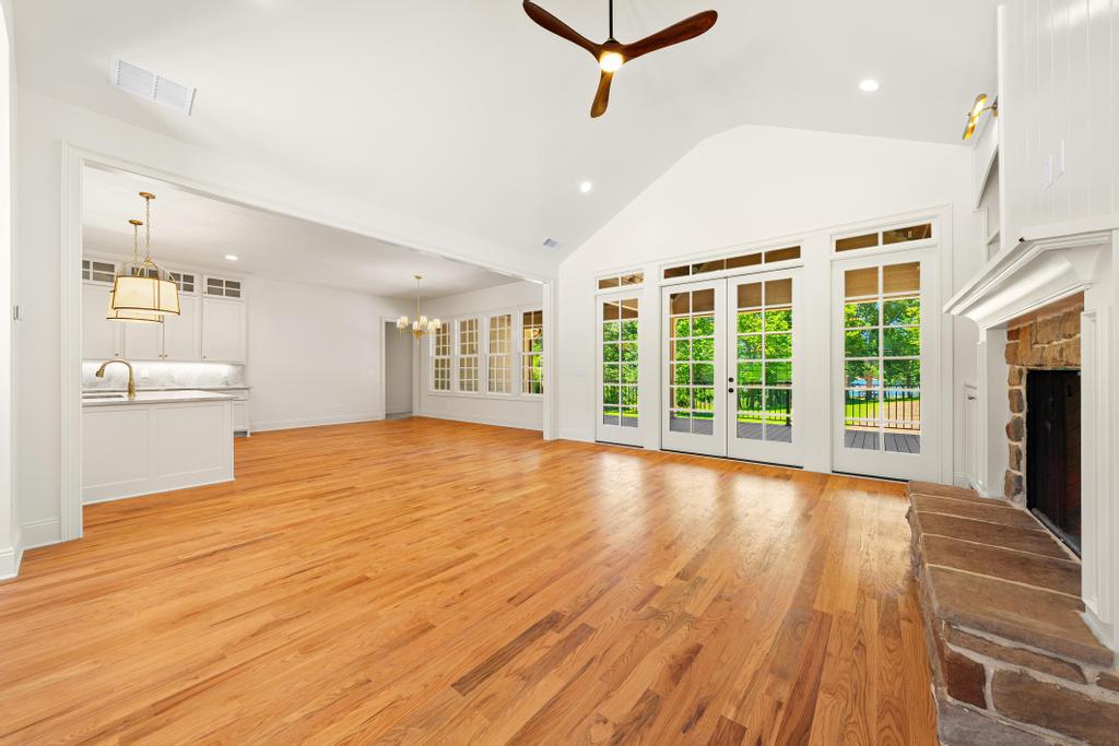 707 Vickery Street Extension Hartwell, GA 30643 - Photo 5 of 50 A spacious common area with vaulted ceilings and beautiful hardwood floors throughout.