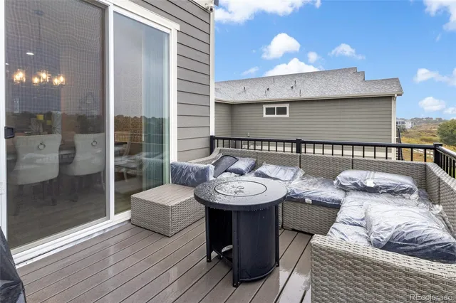 a view of a chairs and table in the balcony
