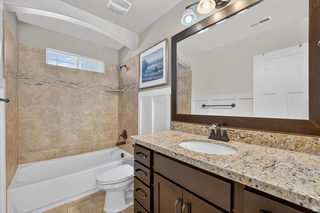14714 South Bright Wood Road Herriman, UT 84096 - Photo 30 of 41 Full bathroom featuring shower / washtub combination, vanity, and light tile patterned flooring