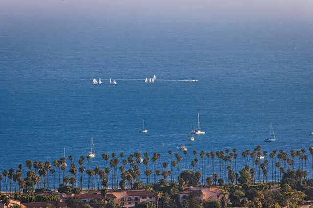an aerial view of a house with outdoor space and sitting area