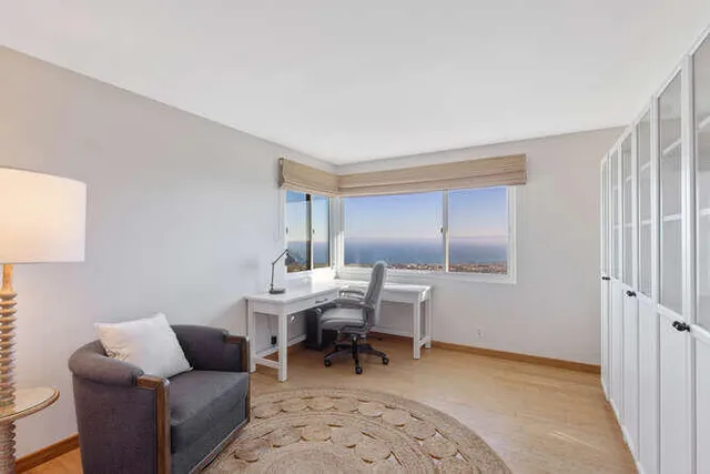 a view of a balcony with furniture