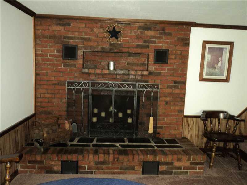 132 Downs Road Sebec, ME 04481 - Photo 5 of 16 Other. Living room end fireplace
