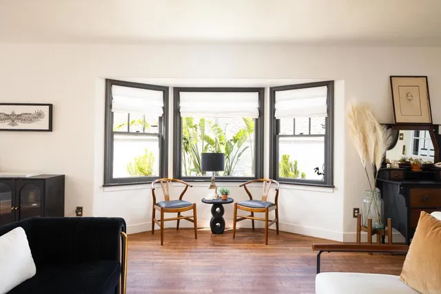 a living room with furniture and a window