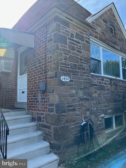 1424 Faunce Street Philadelphia, PA 19111 - Photo 19 of 19 a brick building with a bench in front of door