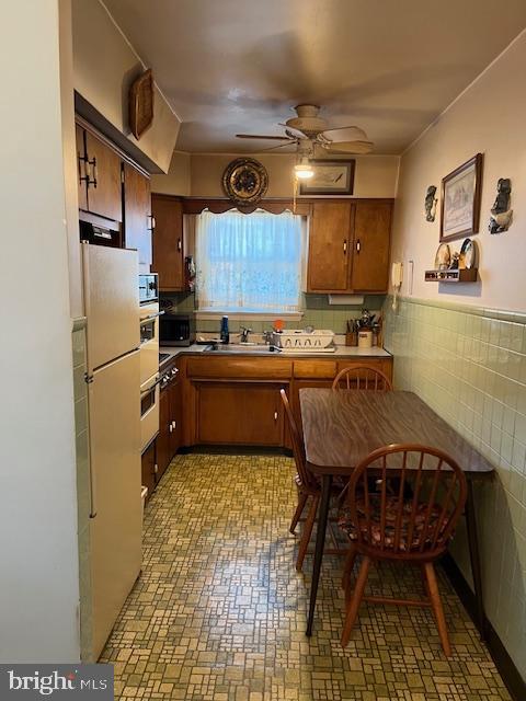 1424 Faunce Street Philadelphia, PA 19111 - Photo 6 of 19 a kitchen with a sink appliances and cabinets