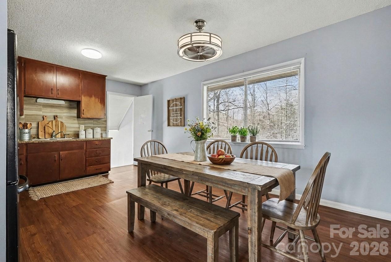 2601 Devon Drive Dallas, NC 28034 - Photo 15 of 35 a view of a dining room with furniture window and wooden floor