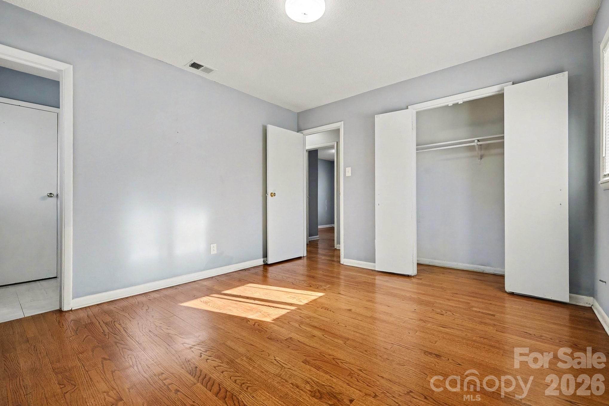 2601 Devon Drive Dallas, NC 28034 - Photo 24 of 35 a view of an empty room with wooden floor