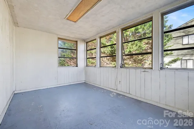 an empty room with windows