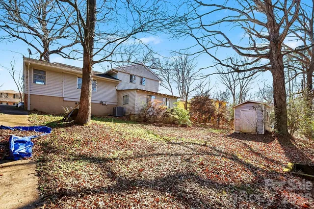 a backyard of a house with lots of green space