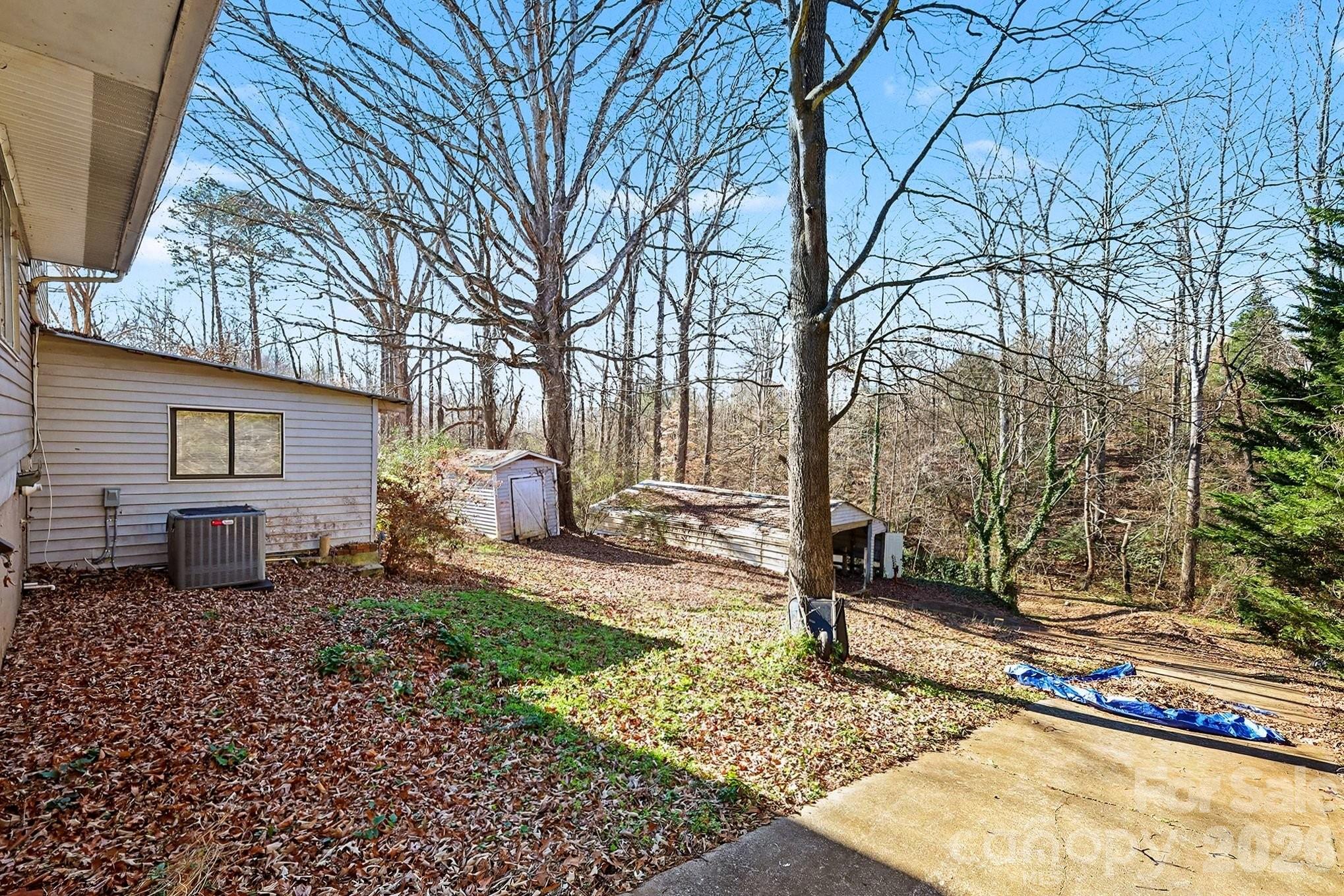 2601 Devon Drive Dallas, NC 28034 - Photo 5 of 35 a backyard of a house with table and chairs