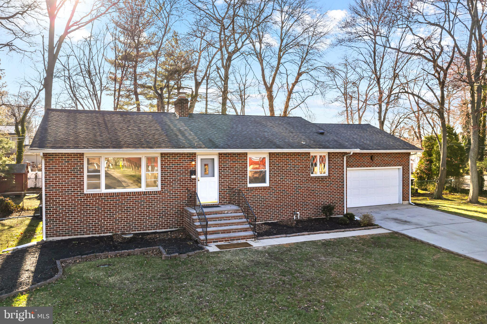 a backyard of a house with barbeque oven and outdoor seating