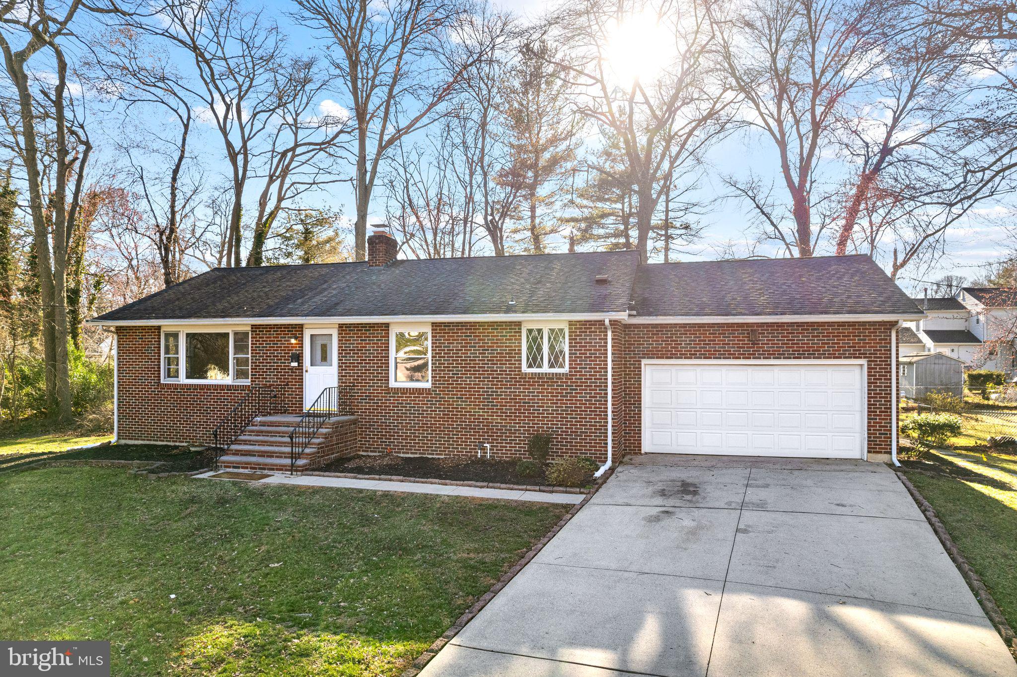 204 Linden Avenue Pitman, NJ 08071 - Photo 2 of 15 a front view of a house with a yard and a garage