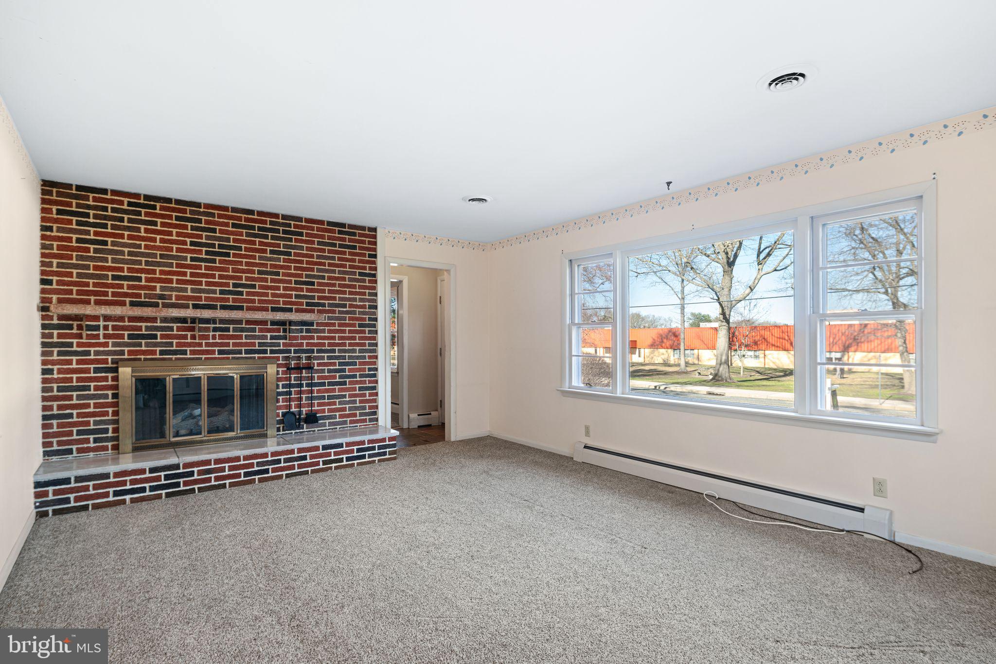 204 Linden Avenue Pitman, NJ 08071 - Photo 5 of 15 an empty room with windows