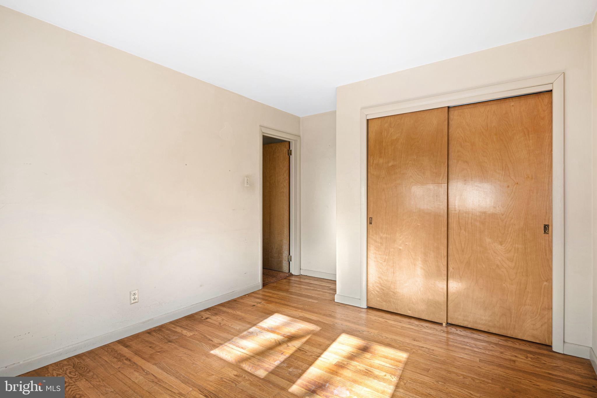 204 Linden Avenue Pitman, NJ 08071 - Photo 8 of 15 a view of empty room with wooden floor and fan