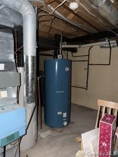1117 Cedar Ridge Road Oyster Bay, NY 11771 - Photo 30 of 41 a room with water heater and wooden cabinets