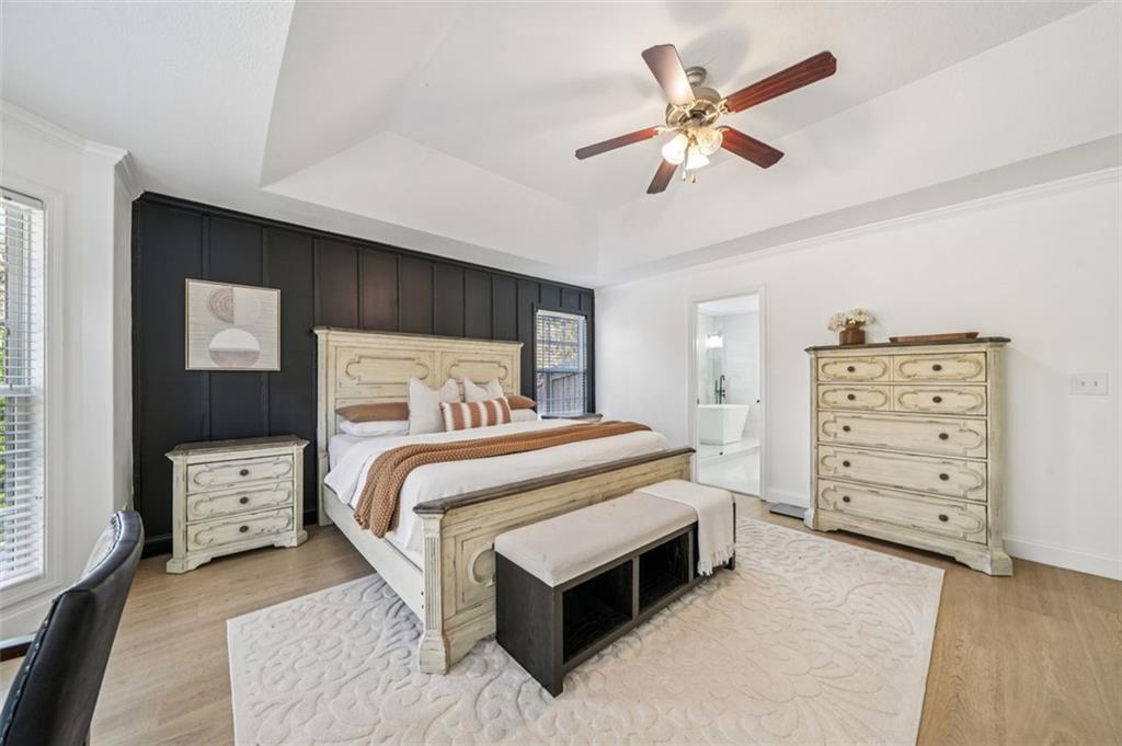 198 Celestial Run Winder, GA 30680 - Photo 11 of 30 a bedroom with a bed and a ceiling fan