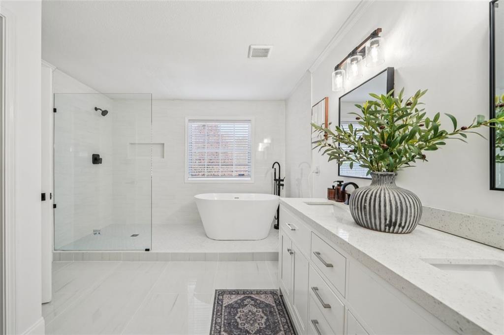 198 Celestial Run Winder, GA 30680 - Photo 13 of 30 a bathroom with a sink a mirror and a bathtub