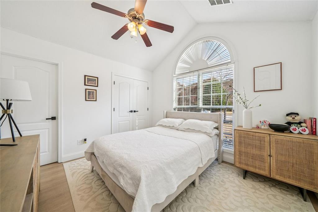 198 Celestial Run Winder, GA 30680 - Photo 16 of 30 a bedroom with a large bed and a chandelier