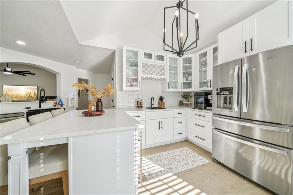 198 Celestial Run Winder, GA 30680 - Photo 2 of 30 a kitchen with stainless steel appliances a refrigerator sink and cabinets