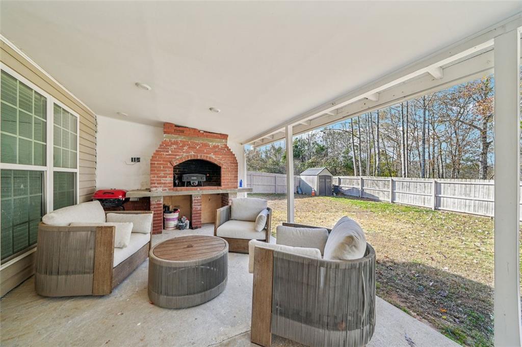 198 Celestial Run Winder, GA 30680 - Photo 24 of 30 a living room with furniture and a floor to ceiling window