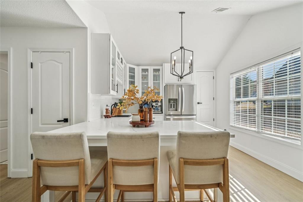198 Celestial Run Winder, GA 30680 - Photo 27 of 30 a dining room with furniture a chandelier and window