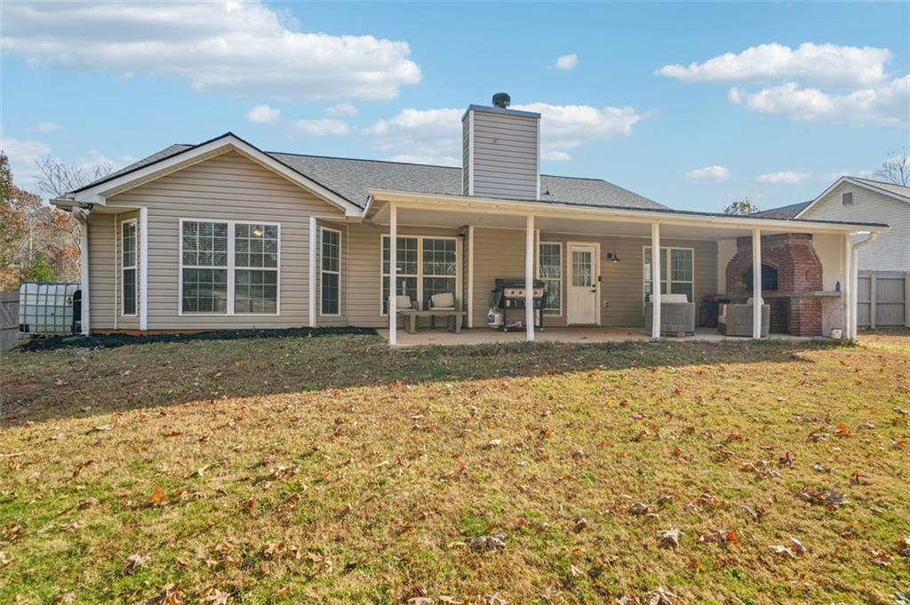 198 Celestial Run Winder, GA 30680 - Photo 28 of 30 a front view of a house with a yard and garage