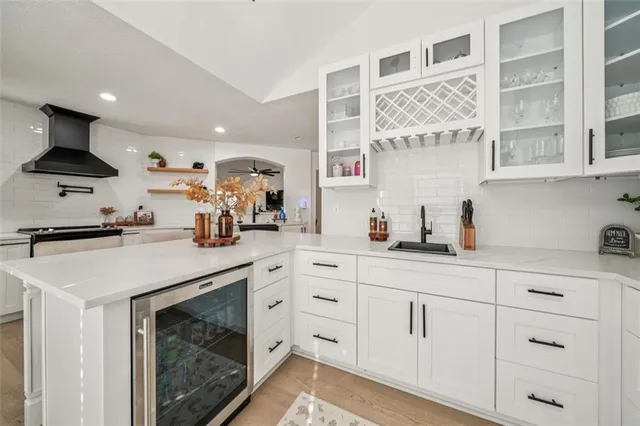 a kitchen with cabinets and appliances