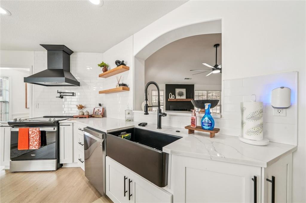 198 Celestial Run Winder, GA 30680 - Photo 4 of 30 a kitchen with stainless steel appliances a sink stove and refrigerator